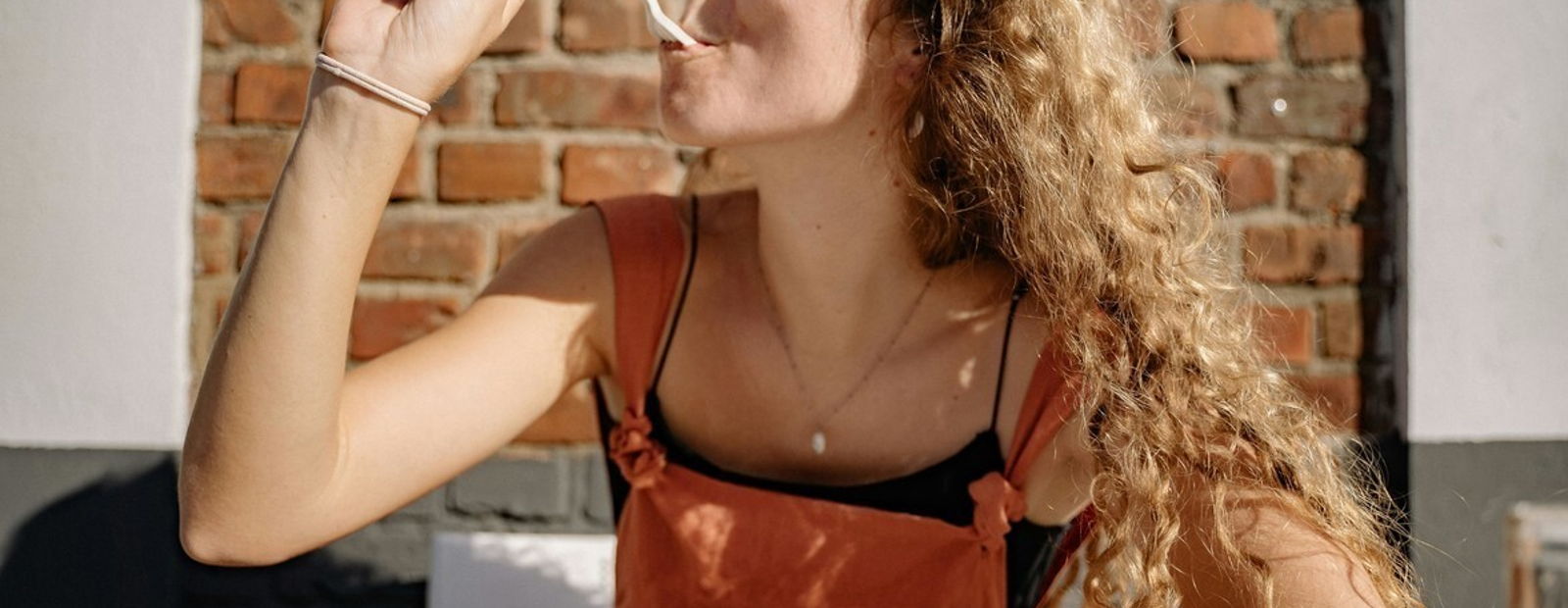 Person practicing mindful eating, savoring a meal without distractions