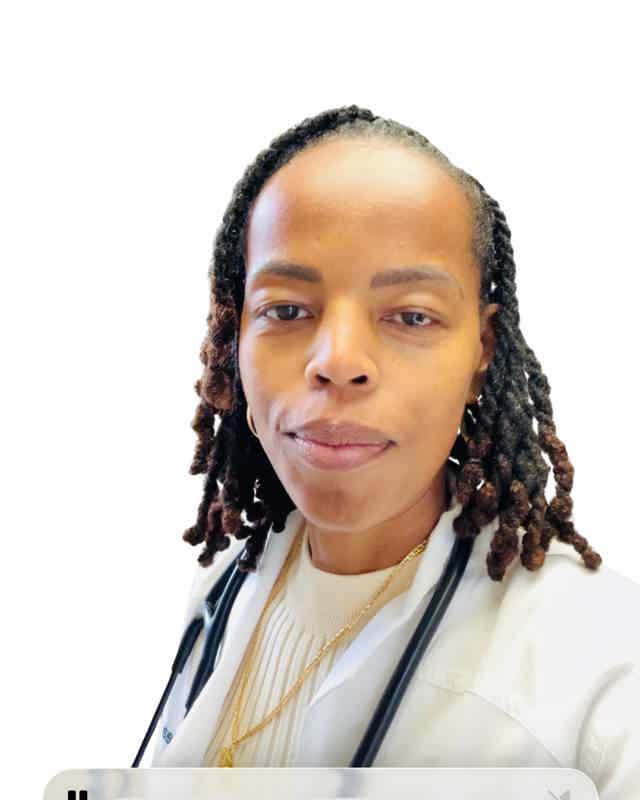 Medical professional with stethoscope, wearing white coat, calm expression.