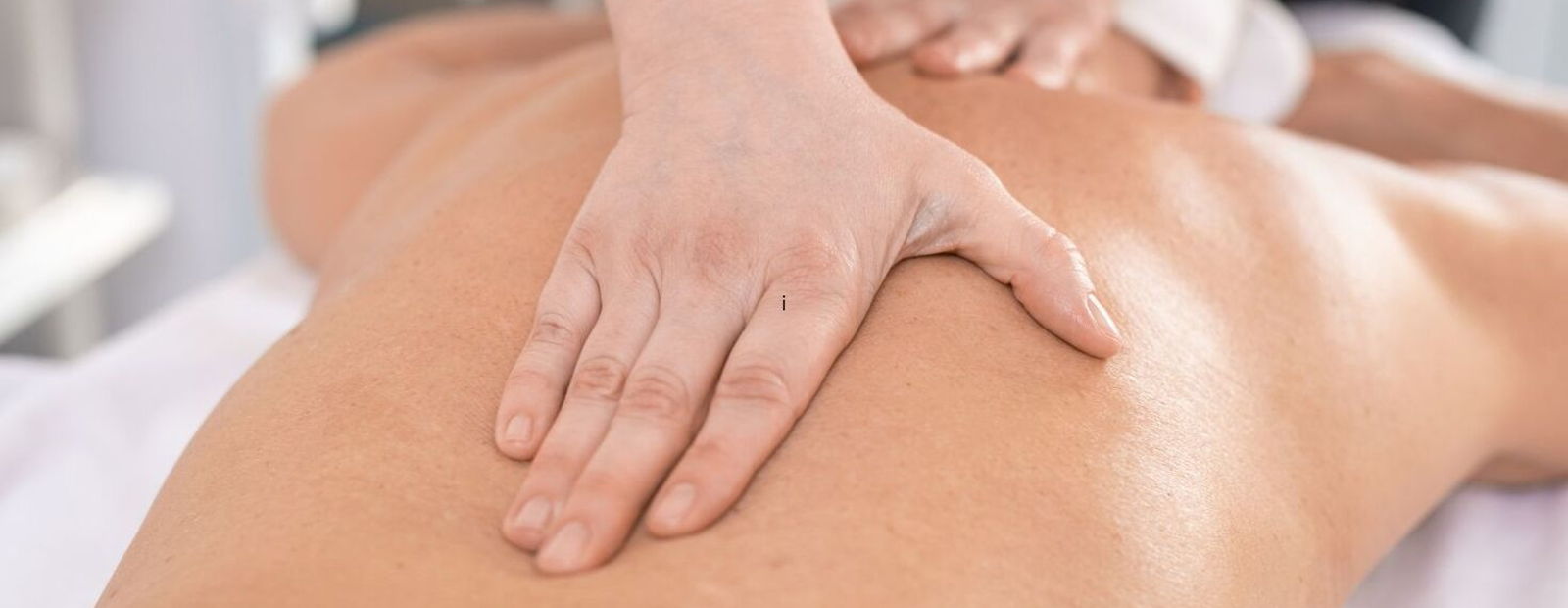 Registered massage therapist performing sports massage for pain relief