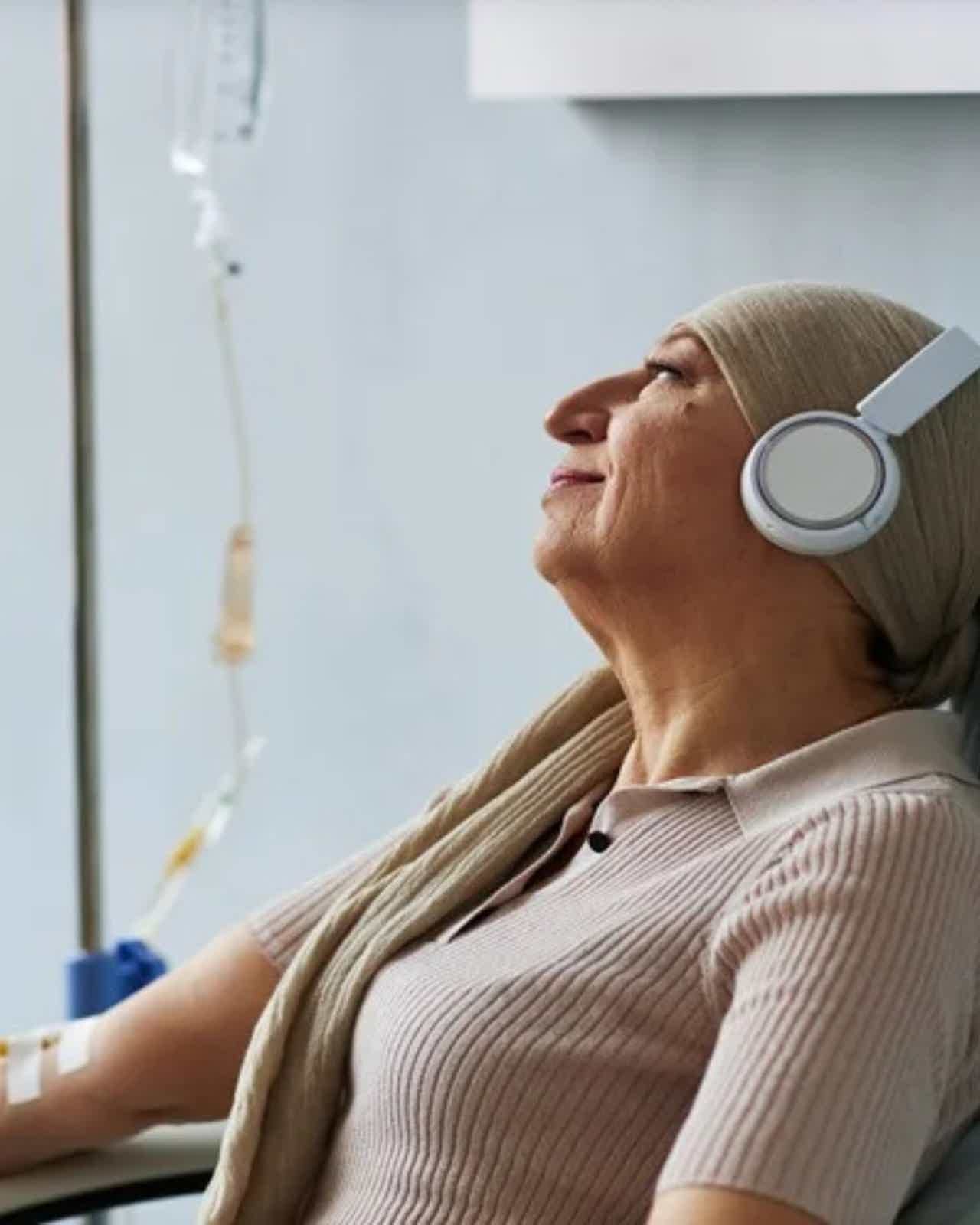 Medical professional with stethoscope, wearing white coat, calm expression.