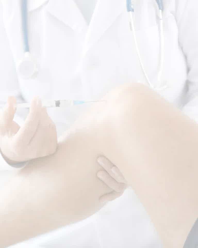 A clinician at BioRevive Calgary preparing a regenerative injection therapy treatment — a precise, natural approach to promote tissue repair and reduce pain using the body’s own healing potential.