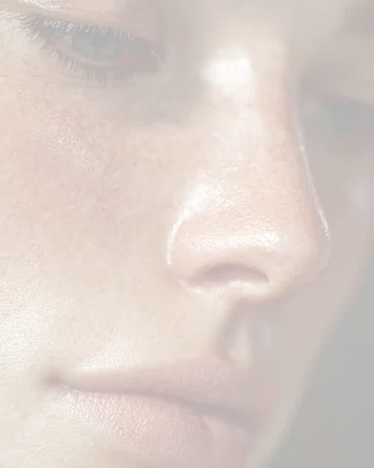 Close-up of clear, smooth skin highlighting pigmentation details, promoting Biorevive treatment in Calgary for skin renewal.