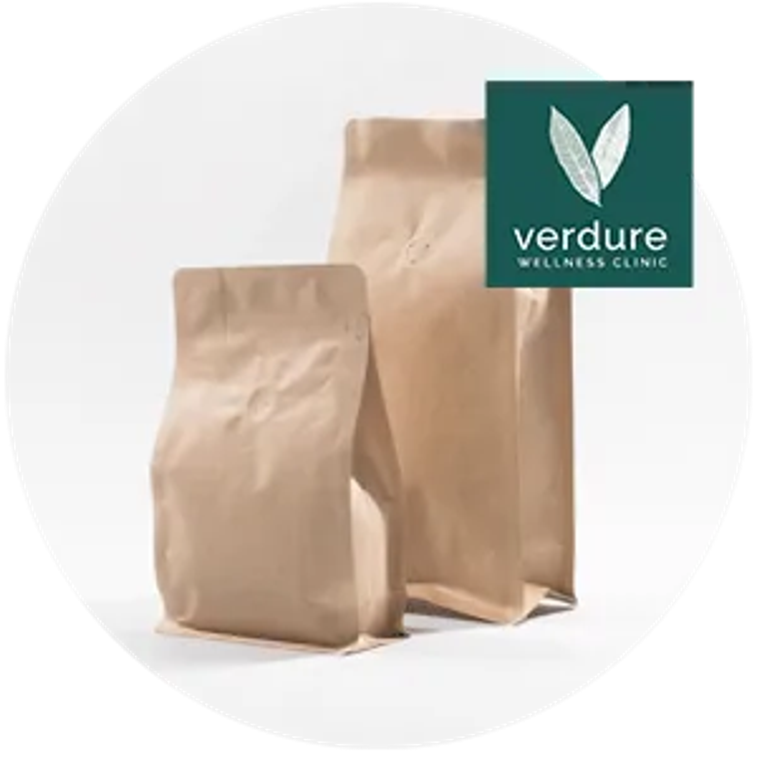 Brown paper bags with “verdure Wellness Clinic” logo and greenery icon on a white background.