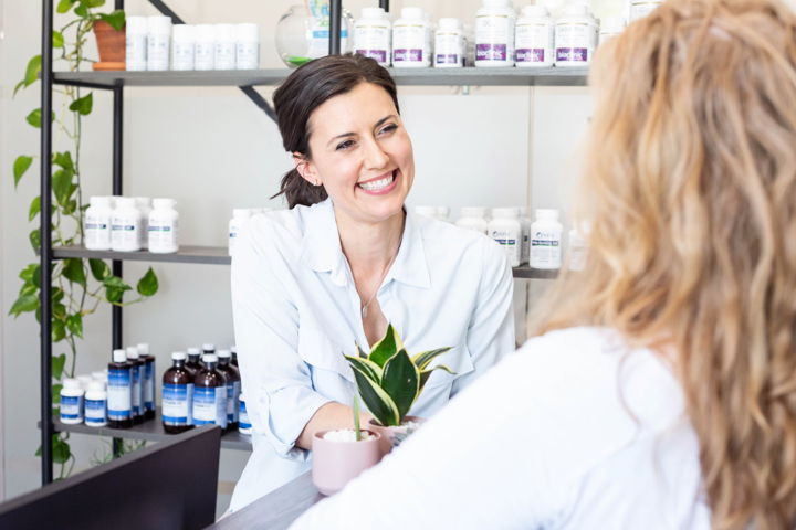 Dr. Andrea Gri, ND, meeting with a patient in her clinic
