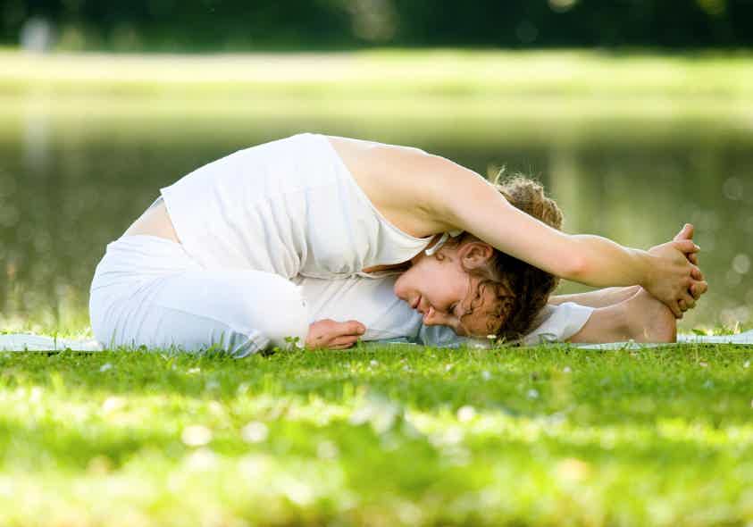 A person stretching and exercising to help reduce inflammation.