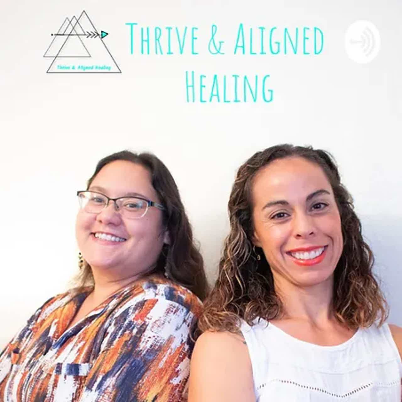 Two smiling women portrait against “THRIVE & ALIGNED HEALING” text backdrop.