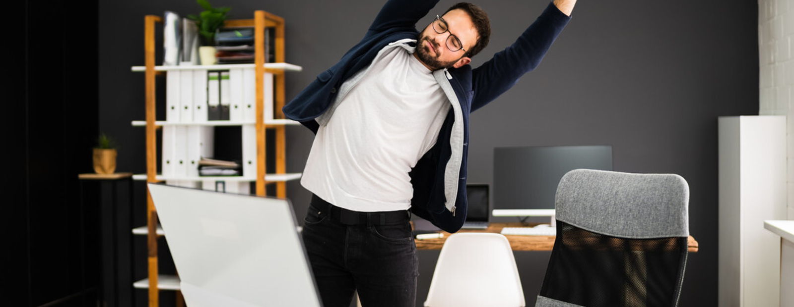 Office worker receiving massage therapy for neck and shoulder tension