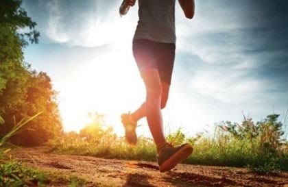 Runner performing a dynamic stretch before a run