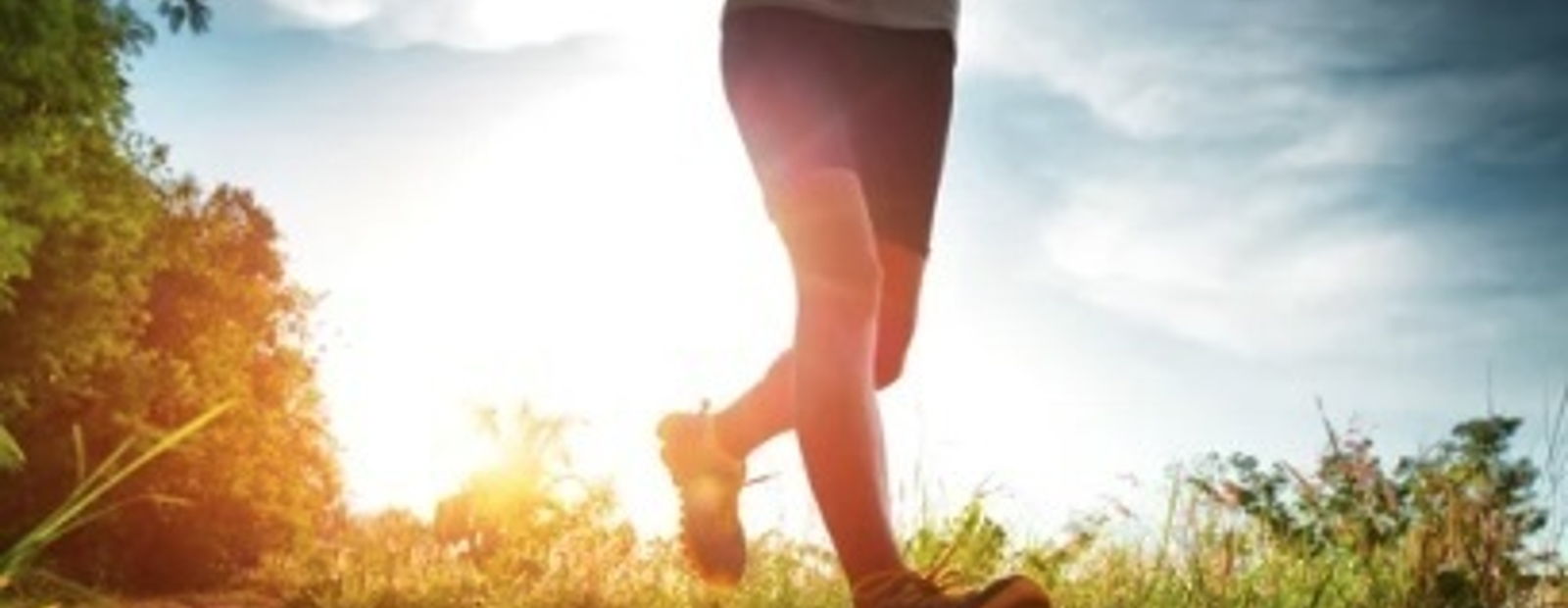 Runner performing a dynamic stretch before a run