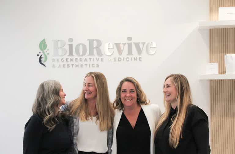 BioRevive Regenerative Medicine team standing together in the reception area of our Calgary clinic. Our expert staff provide personalized hormone optimization, regenerative wellness, and aesthetic treatments in a welcoming, modern healthcare environment