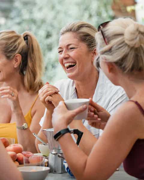 Image of a group of laughing, middle-aged women enjoying time together outdoors — representing the confidence, vitality, and wellbeing supported through BioRevive Calgary’s integrative wellness and aesthetic services, including hormone optimization, skin rejuvenation, and preventative health care.