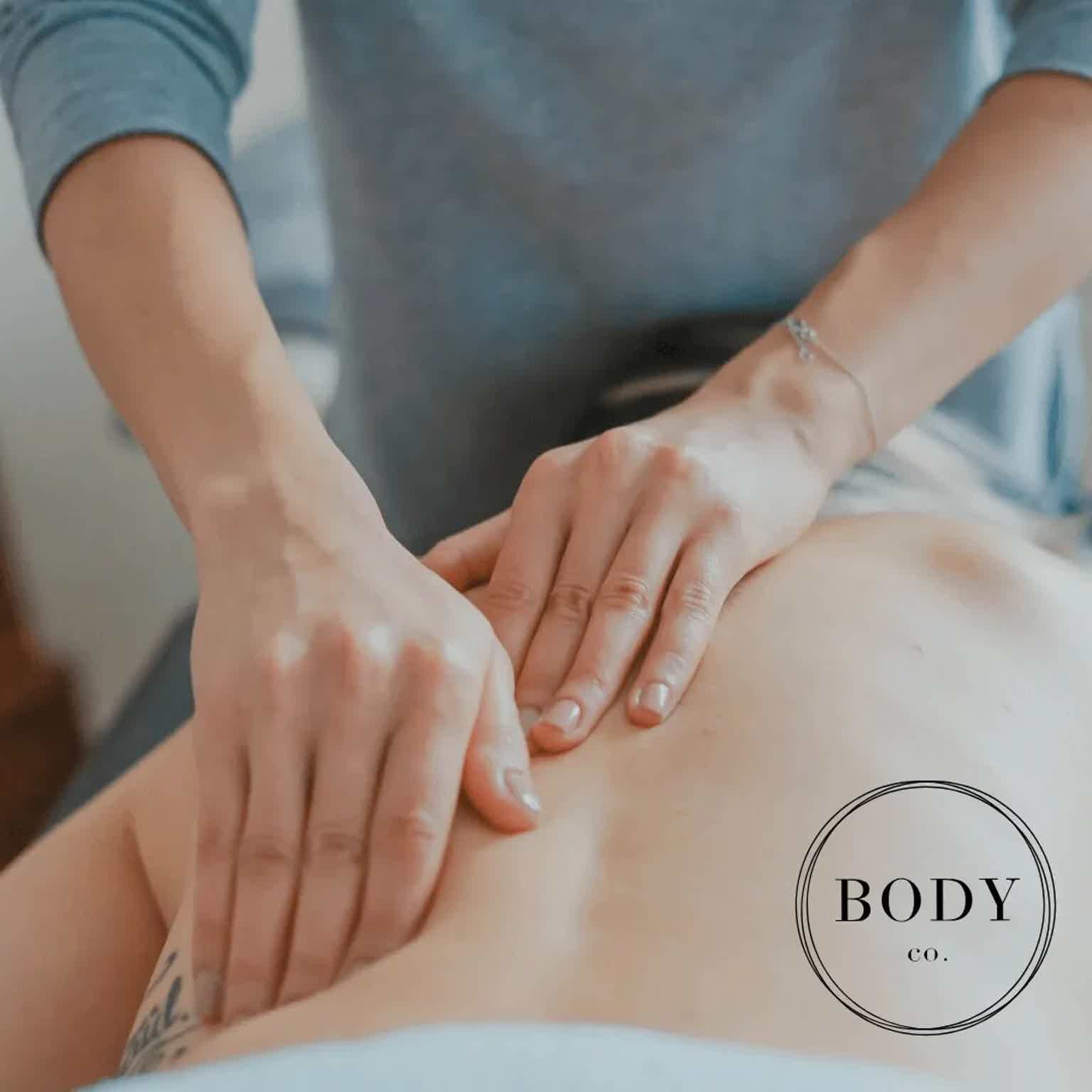 massage therapist massaging client
