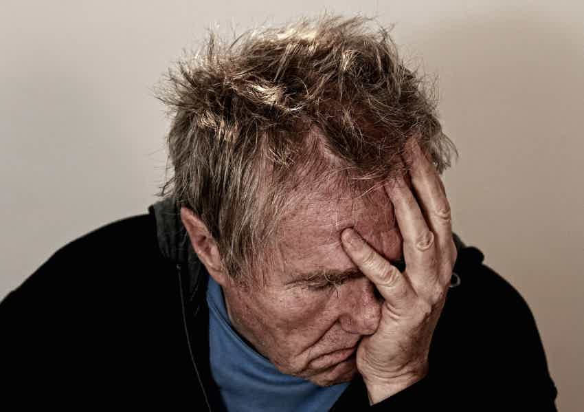 A person experiencing chronic fatigue as a result of being burnt out.