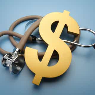 Gold dollar sign intertwined with a stethoscope, symbolizing medical costs or healthcare finance.