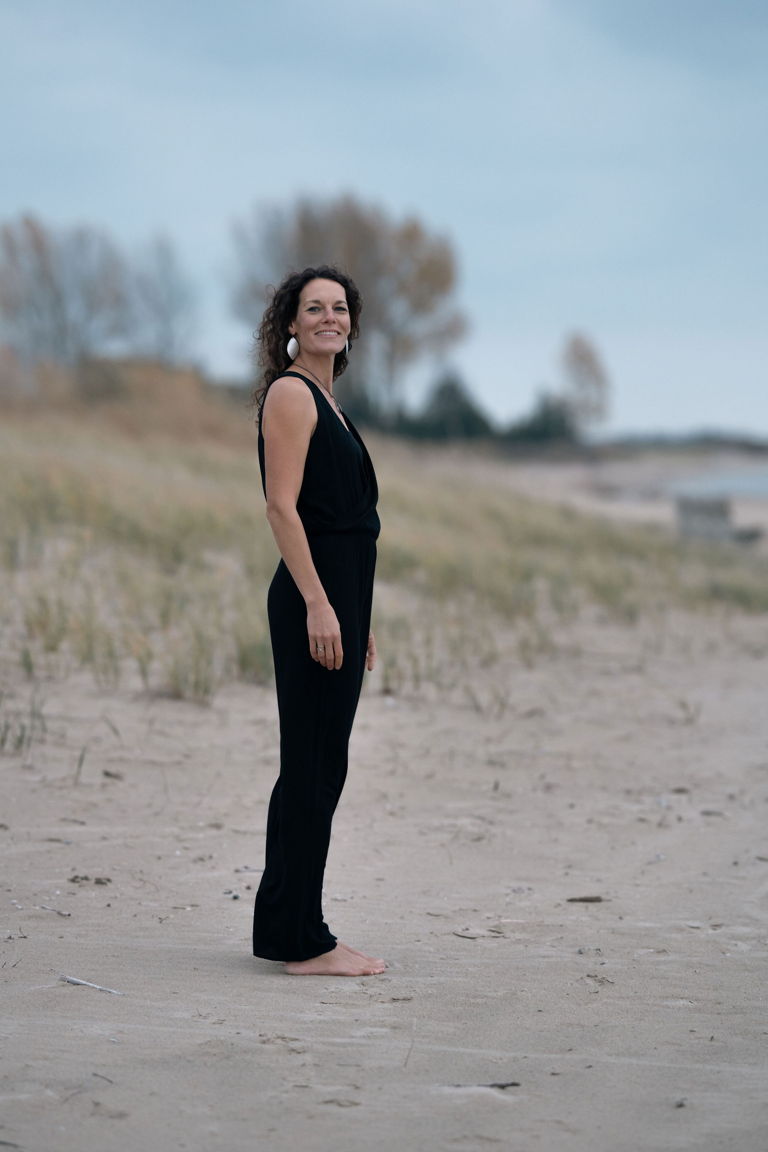 Dr. Andrea standing on the beach