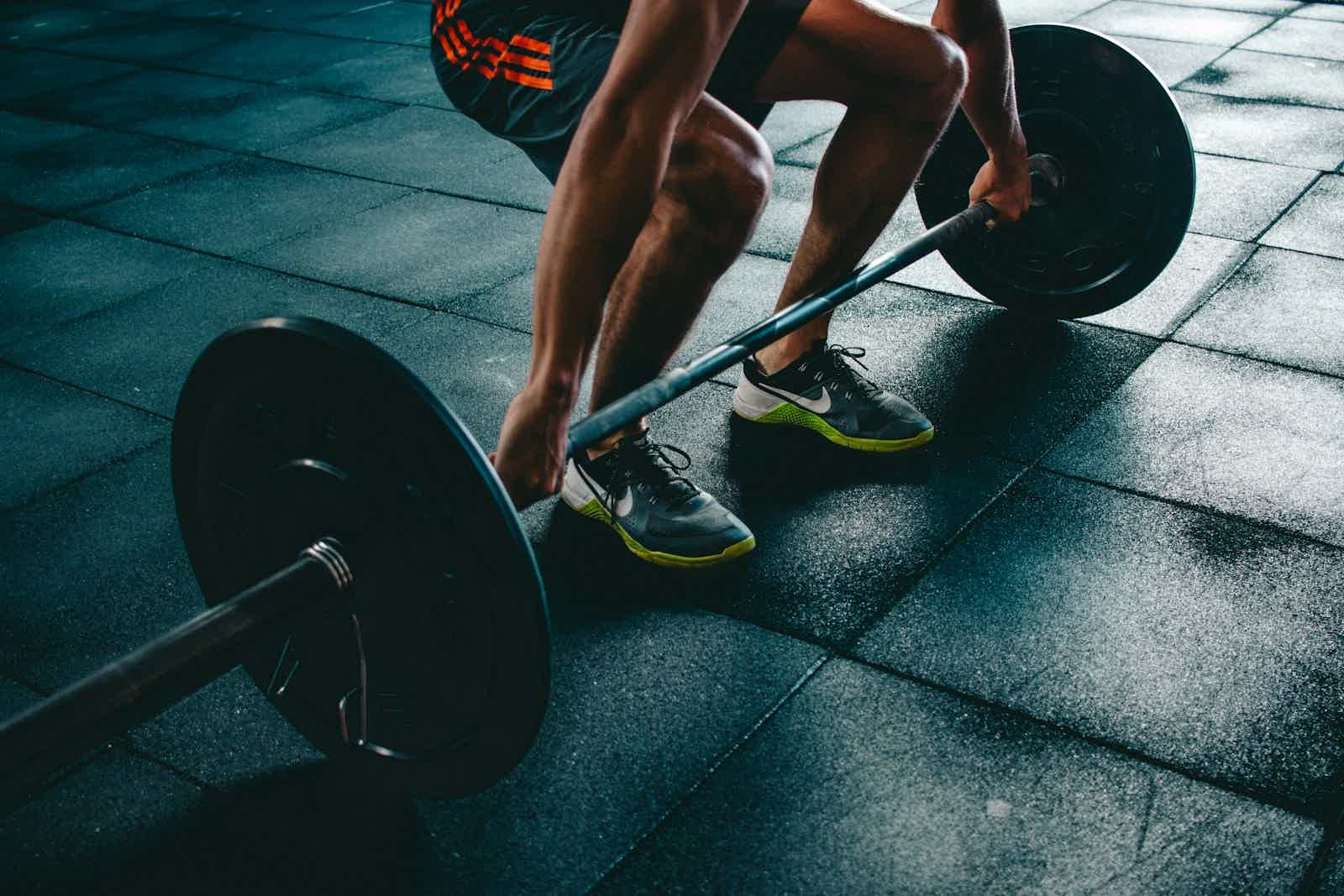 Athlete doing single-leg squats at a gym