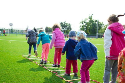 Child engaged in active outdoor play