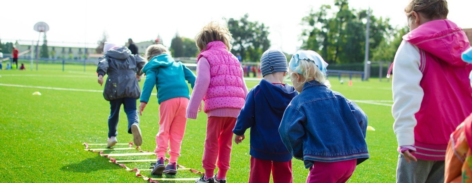 Child engaged in active outdoor play