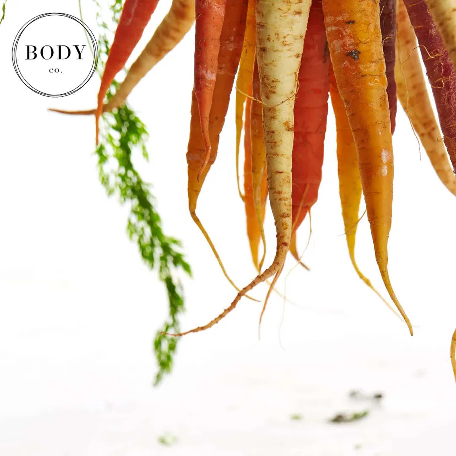 carrots suspended on white background