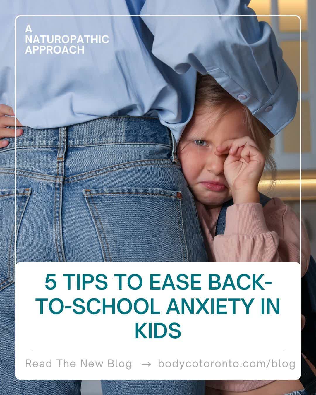 Child peeking from behind blue denim, cozy indoors; text: “5 tips to ease back-to-school anxiety in kids.”