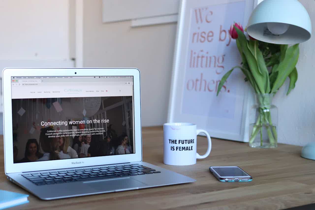 A laptop open to a website about women