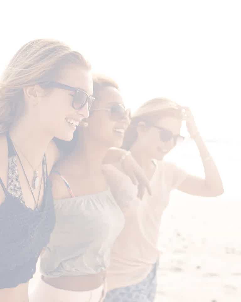 Three women happy because their concerns were heard and they were able to start hormone therapy through BioRevive for perimenopausal symptoms